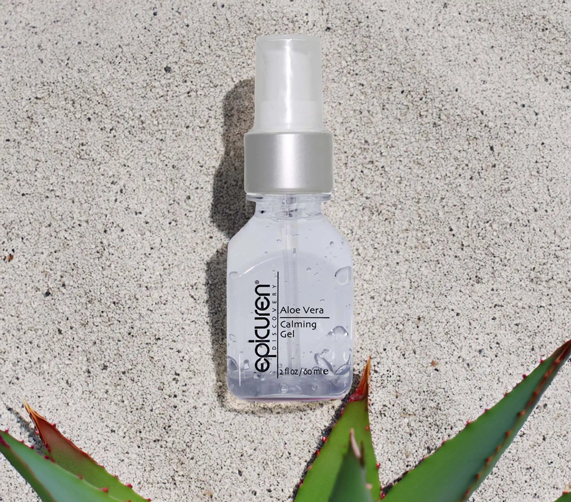 Epicuren aloe vera gel bottle on a textured surface with an aloe plant leaf.
