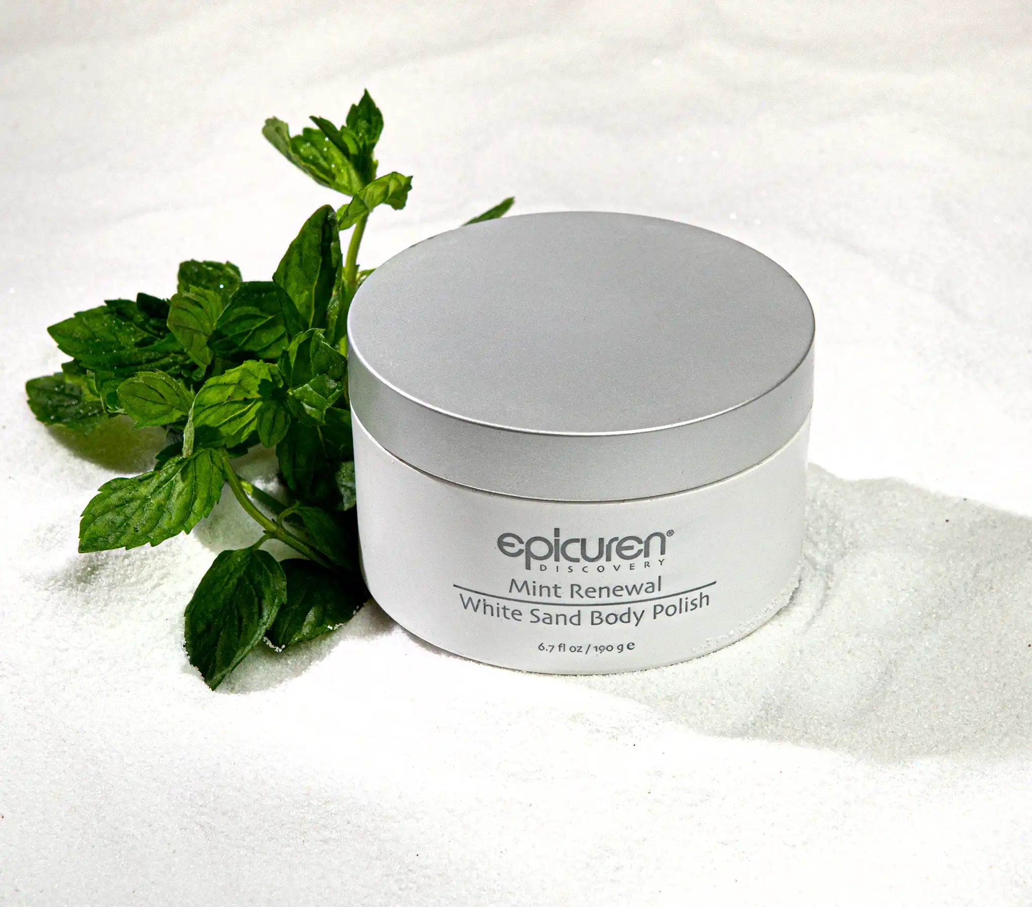 Jar of Epicuren Mint Renewal White Sand Body Polish with mint leaves on a white background
